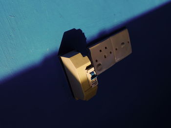 High angle view of camera on table against wall