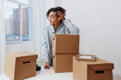 Portrait of woman holding box