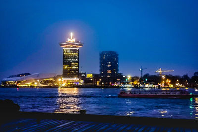 Illuminated buildings in city at night