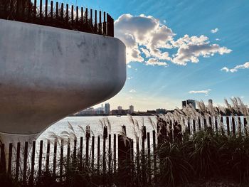 Panoramic view of wooden post against sky during sunset