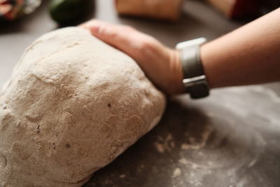 Cropped hand of person preparing food