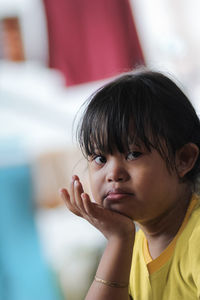 Close-up portrait of boy looking away