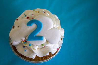 Top view of a party cupcake with number two