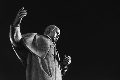 Low angle view of statue against black background in ukraine