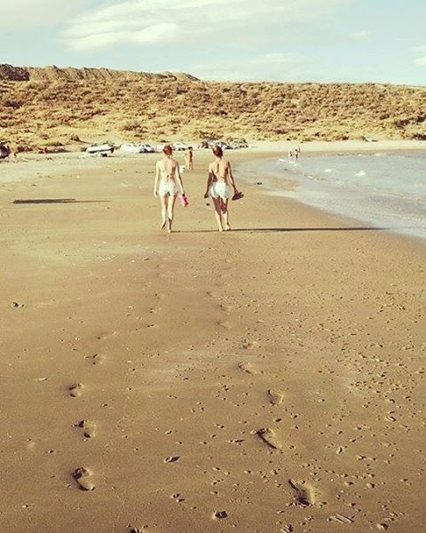 beach, sand, domestic animals, shore, sky, animal themes, mammal, sea, walking, dog, nature, full length, sunlight, day, tranquility, men, pets, water, tranquil scene