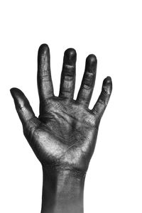 Close-up of human hand against white background