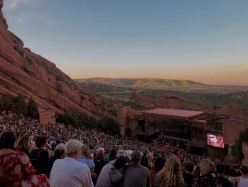 Crowd at concert during sunset