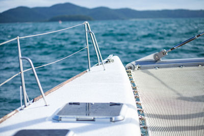 Sailboat sailing on sea against sky