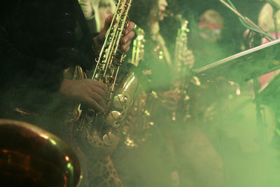 Midsection of men playing musical instruments