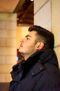 Portrait of young man looking away