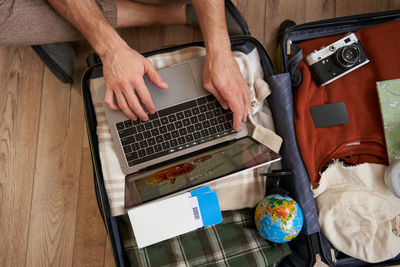 Midsection of man using laptop