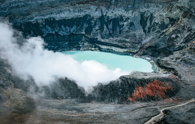 High angle view of lake amidst rock formation