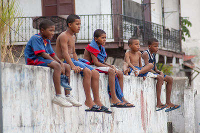 People sitting in front of building