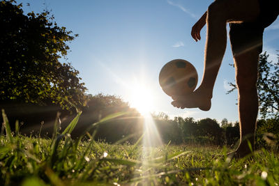 Low angle view of man standing on field