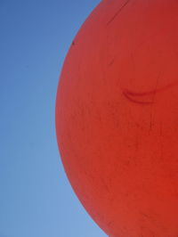 Low angle view of red moon against sky