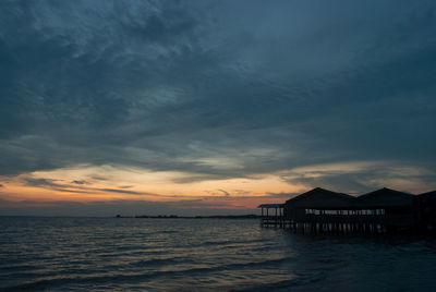 Silhouette of pier at sunset