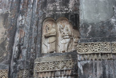 Low angle view of statue against temple