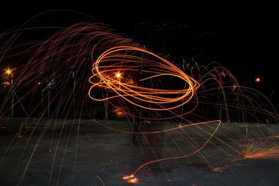 Light painting against sky at night