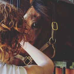 Portrait of young woman holding camera