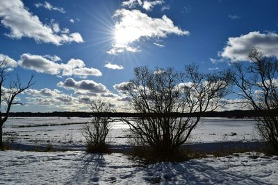 Scenic view of lake against cloudy sky