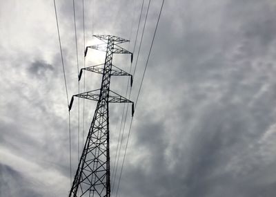 Low angle view of electricity pylon against sky