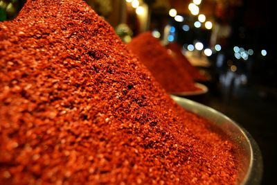 Close-up of red chili peppers in container