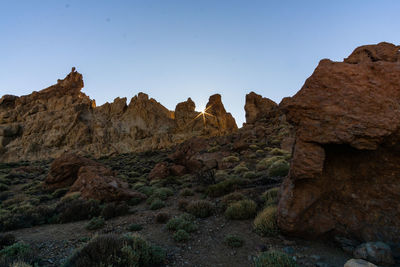 Scenic view of rocky mountains against clear sky