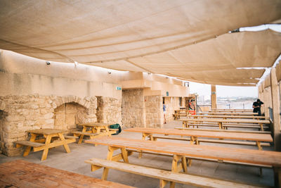 Empty chairs and tables in cafe