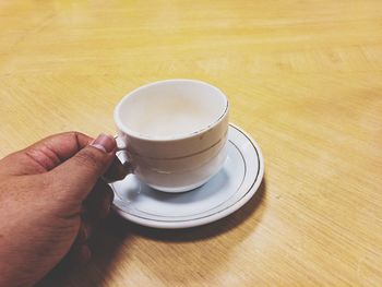 High angle view of coffee cup on table