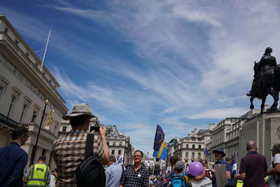 Group of people in front of buildings