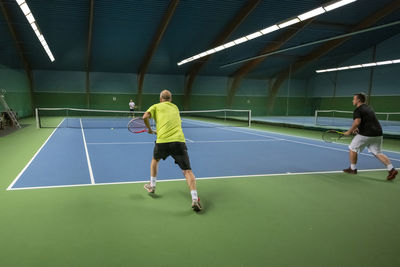 Men playing tennis