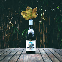 Close-up of information sign on table