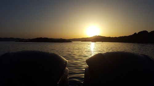 Scenic view of sea against clear sky during sunset