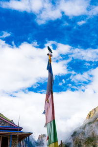 Low angle view of flag against sky