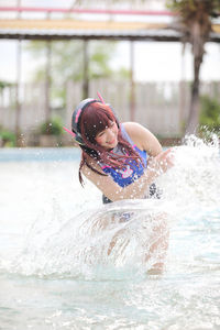 Young woman swimming in sea