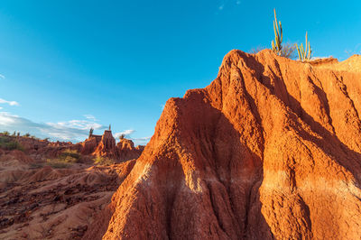 Cliff against blue sky at tatacoa desert
