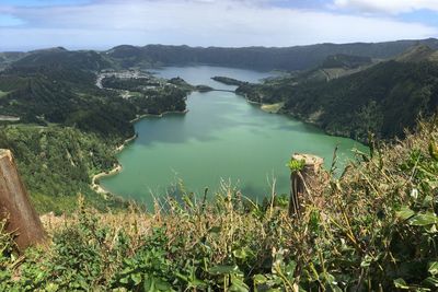 Scenic view of lake and mountains against sky