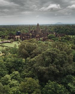 High angle view of trees and buildings against sky