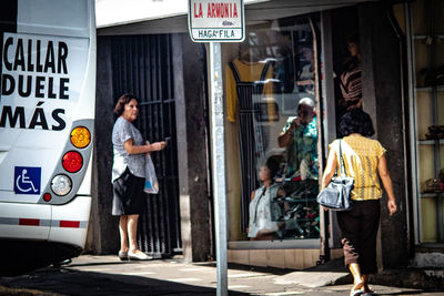 People walking on street in city