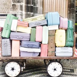 Multi colored luggage on cart