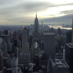 Manhattan against cloudy sky