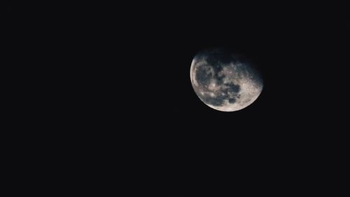 Low angle view of moon against sky at night