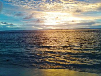 Scenic view of sea against sky at sunset