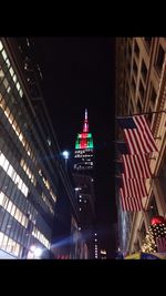 Low angle view of illuminated building at night