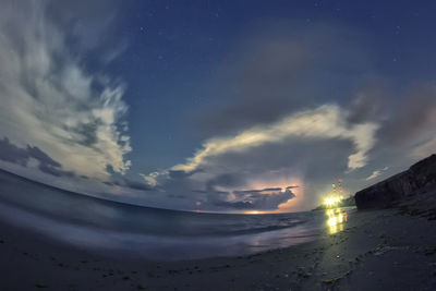 Scenic view of sea against sky at night