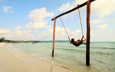 Man on beach against sky