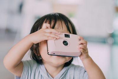 Portrait of woman photographing