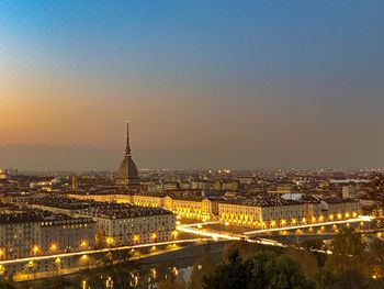 High angle view of city buildings during sunset