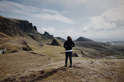 Rear view of man standing on mountain