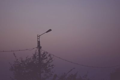 Low angle view of silhouette tree against sky at sunset